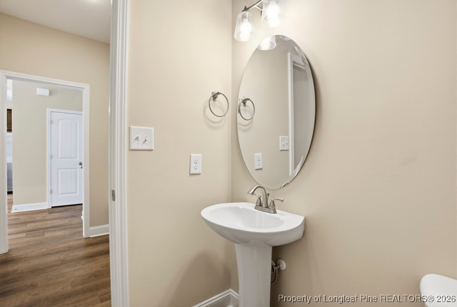 4830 Quiet Pine Road Fayetteville, NC 28314 - Photo 23 of 50 a bathroom with a sink and a mirror