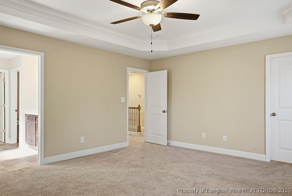 4830 Quiet Pine Road Fayetteville, NC 28314 - Photo 26 of 50 an empty room with a ceiling fan and a window