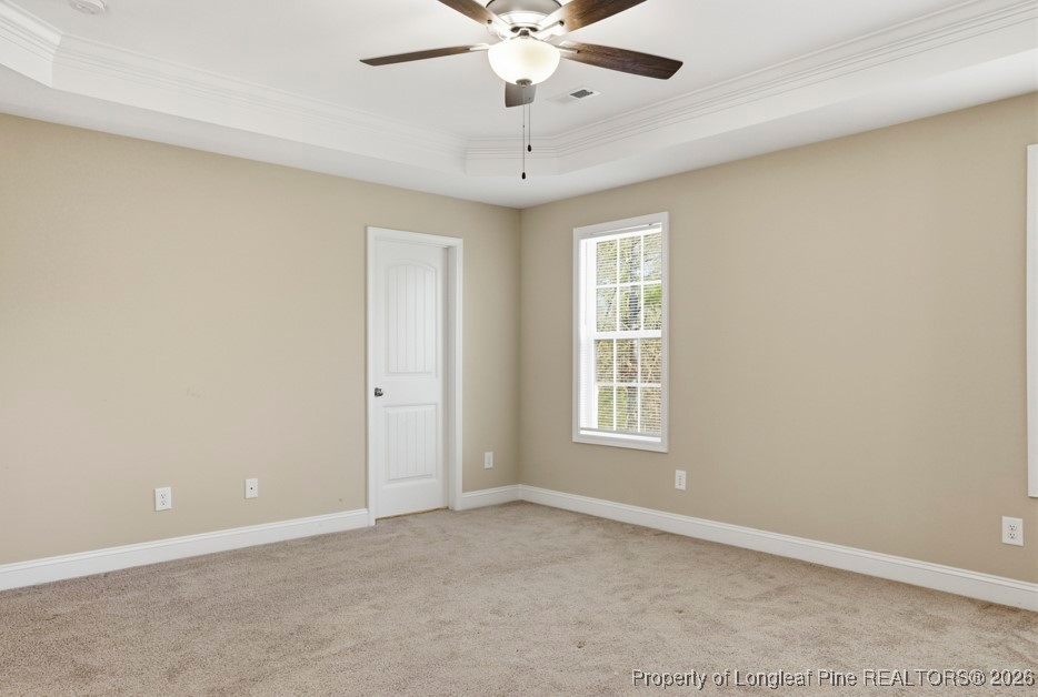 4830 Quiet Pine Road Fayetteville, NC 28314 - Photo 27 of 50 an empty room with windows and ceiling fan