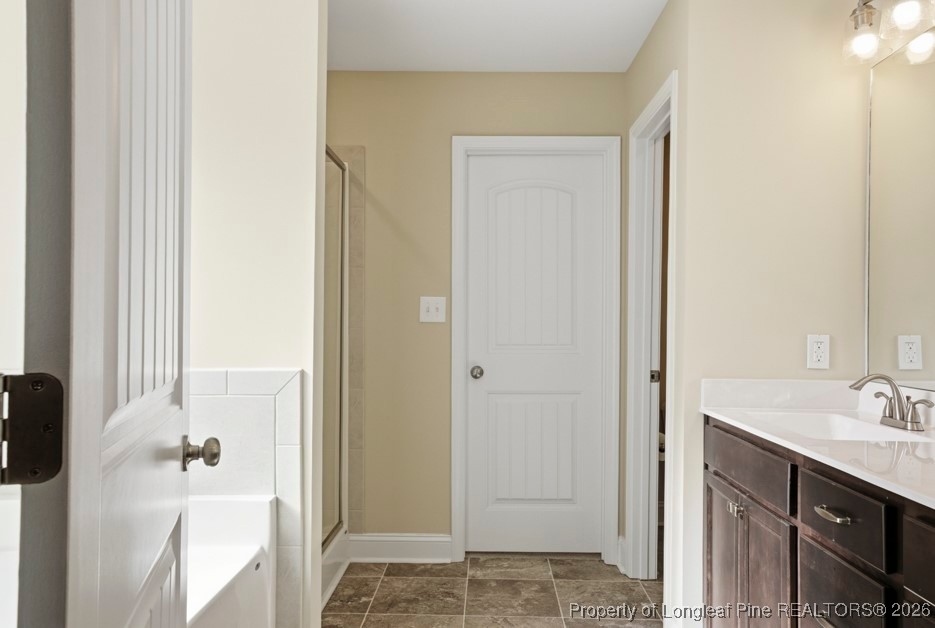 4830 Quiet Pine Road Fayetteville, NC 28314 - Photo 29 of 50 a bathroom with a sink and a mirror