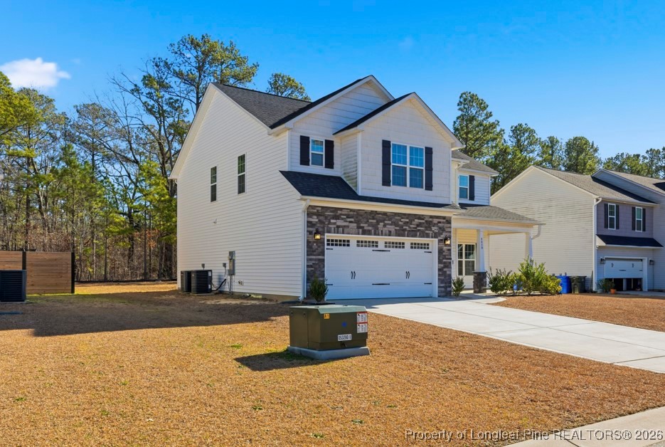 4830 Quiet Pine Road Fayetteville, NC 28314 - Photo 3 of 50 a front view of a house with a yard