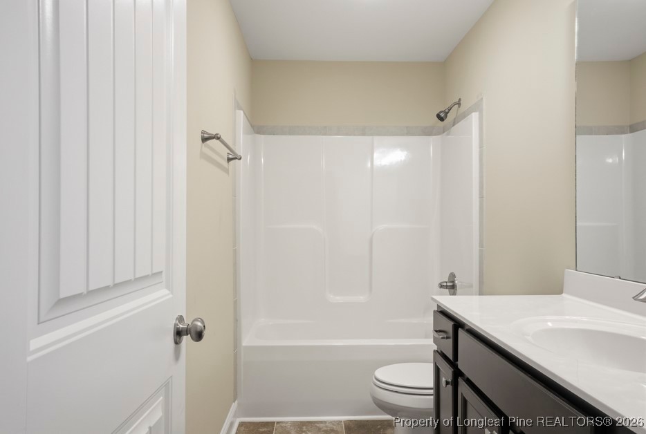 4830 Quiet Pine Road Fayetteville, NC 28314 - Photo 42 of 50 a bathroom with a sink a toilet and shower