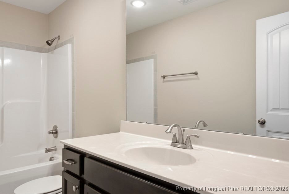 4830 Quiet Pine Road Fayetteville, NC 28314 - Photo 43 of 50 a bathroom with a sink vanity tub and shower
