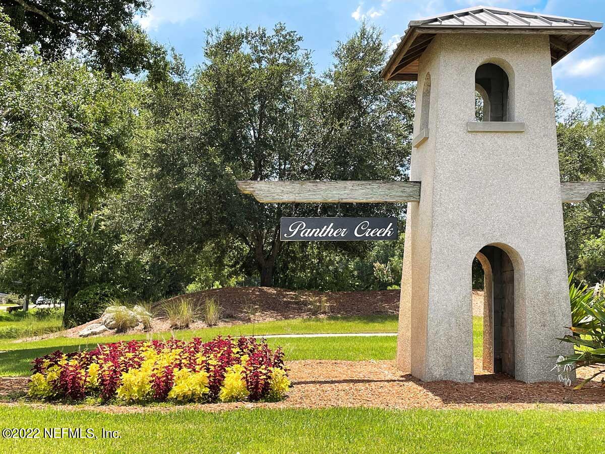 11463 Eagle Vail Court Jacksonville, FL 32221 - Photo 2 of 10 a front view of a house with garden