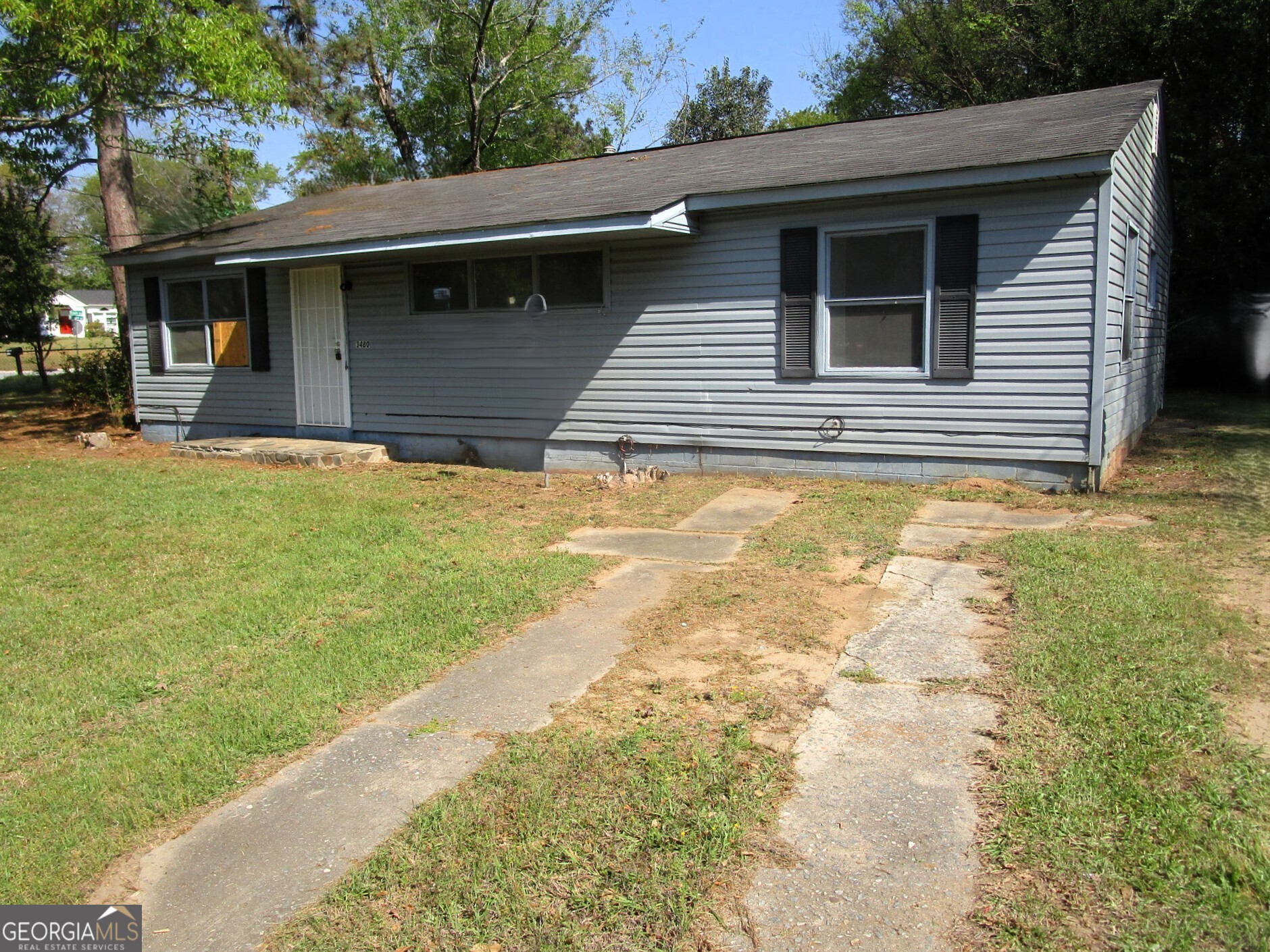 a view of a backyard of the house