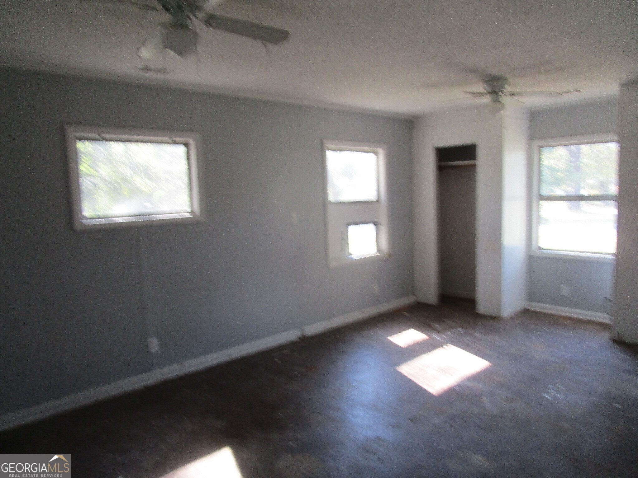 3480 Travis Boulevard Macon, GA 31206 - Photo 11 of 11 an empty room with wooden floor and windows
