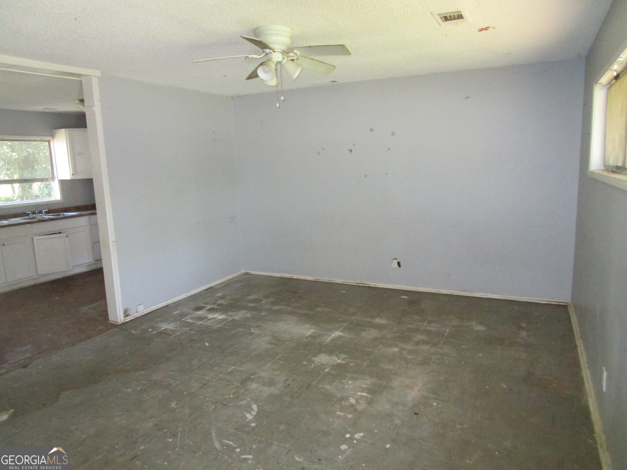 3480 Travis Boulevard Macon, GA 31206 - Photo 2 of 11 wooden floor in an empty room with a window