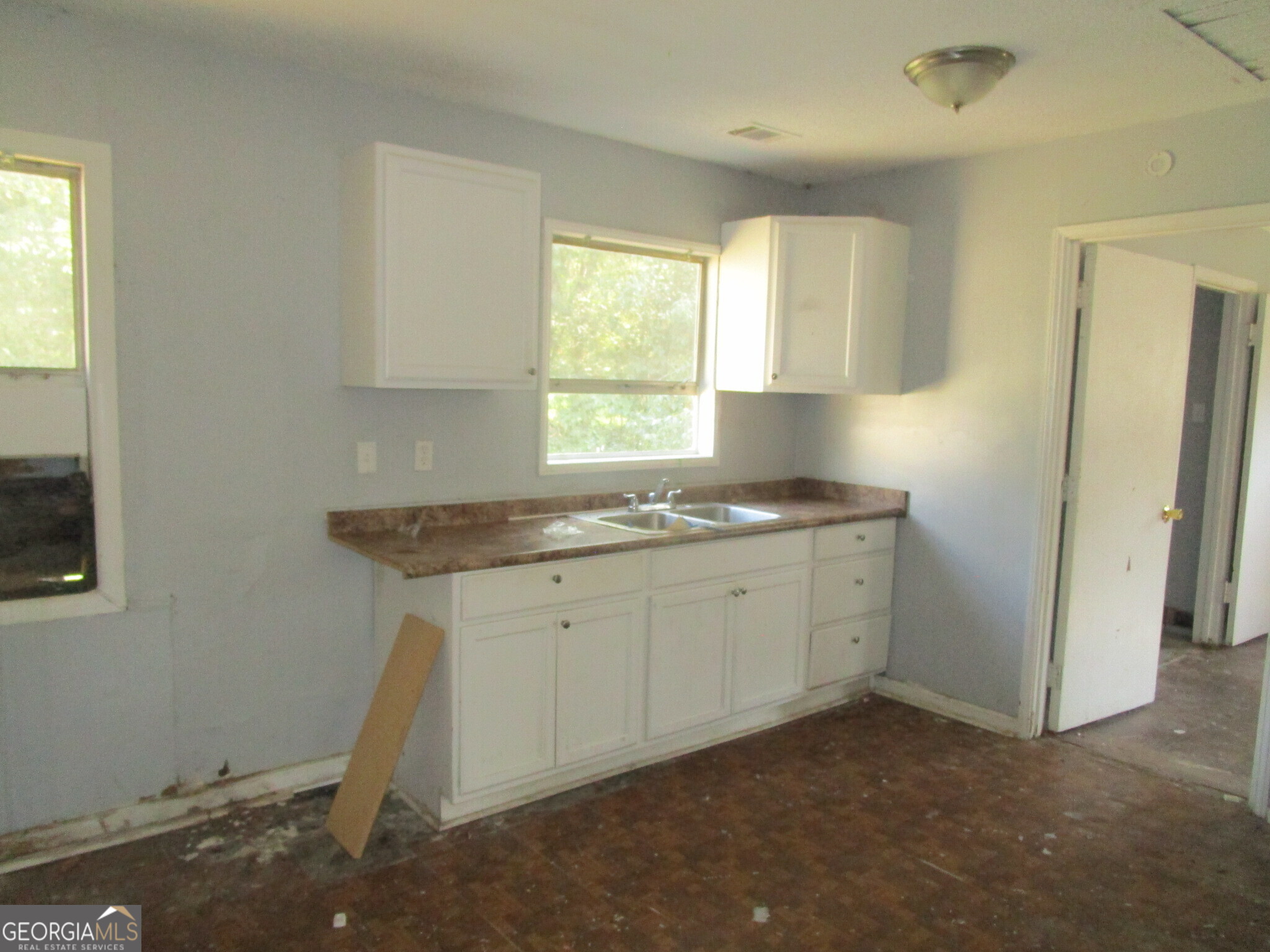 3480 Travis Boulevard Macon, GA 31206 - Photo 4 of 11 a kitchen with sink cabinets and window