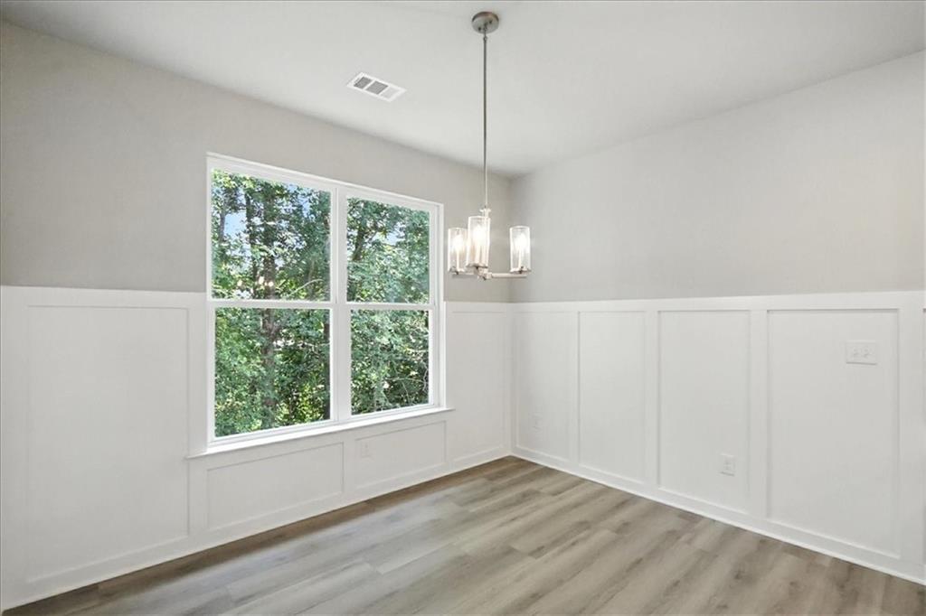 4022 Links Boulevard Jefferson, GA 30549 - Photo 16 of 54 a view of empty room with wooden floor and fan