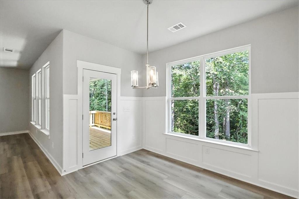 4022 Links Boulevard Jefferson, GA 30549 - Photo 17 of 54 a view of an empty room with wooden floor and a window