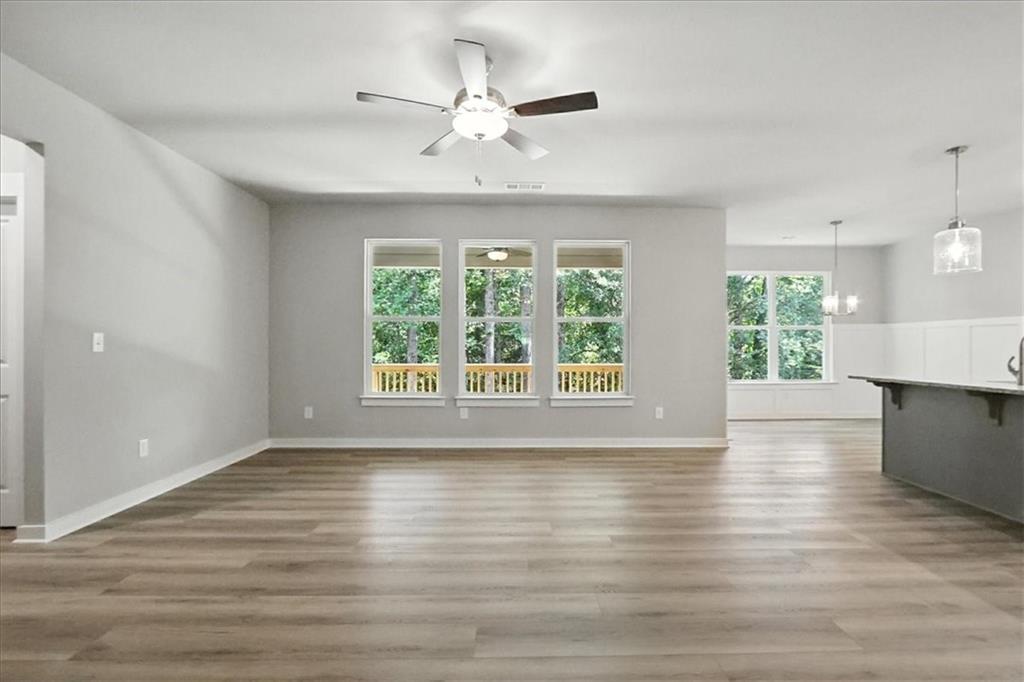 4022 Links Boulevard Jefferson, GA 30549 - Photo 4 of 54 a view of an empty room with wooden floor and a window