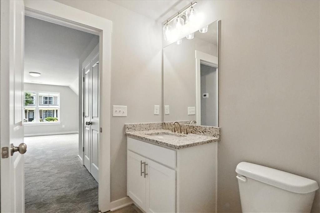 4022 Links Boulevard Jefferson, GA 30549 - Photo 43 of 54 a bathroom with a granite countertop sink toilet and shower
