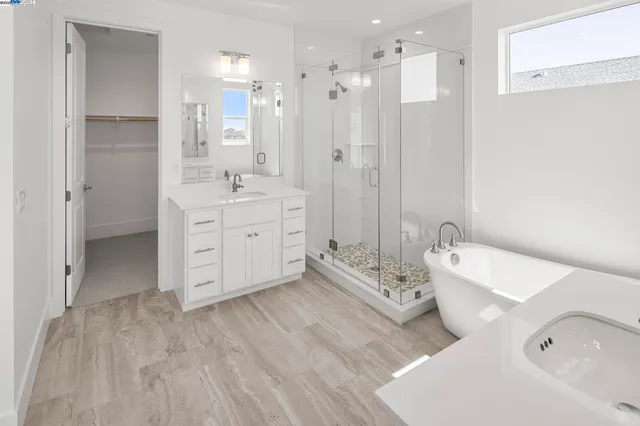 a bathroom with a bathtub shower sink and toilet