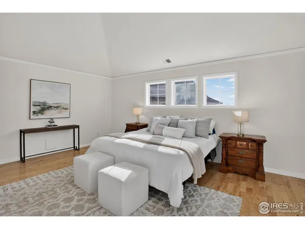 a bedroom with a bed and a desk