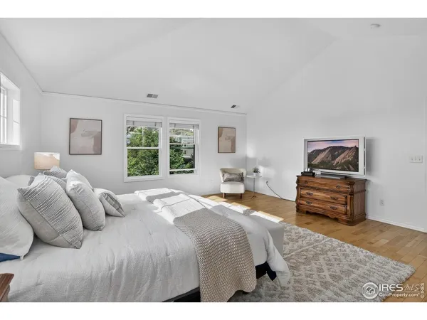 a bedroom with a bed and a couch