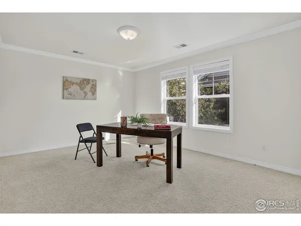 a workspace with furniture and a window