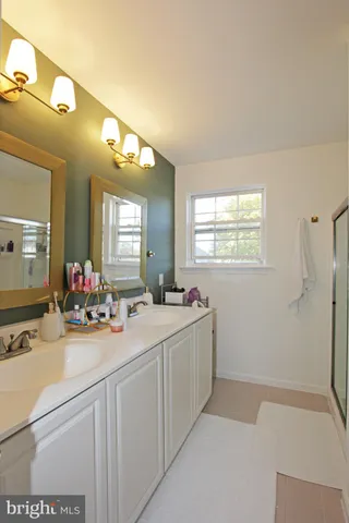 a bedroom with bed and window