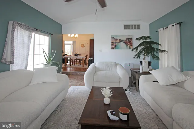 a kitchen with stainless steel appliances granite countertop a stove top oven a refrigerator a sink and dishwasher