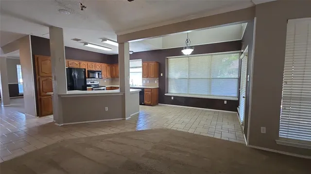 a view of a kitchen and a window