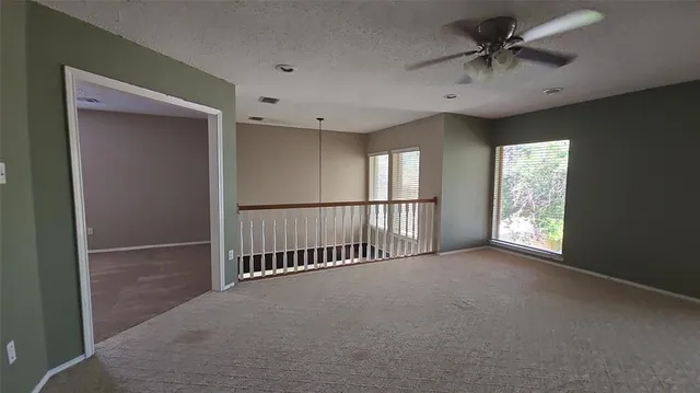 a view of entryway and hall with a window