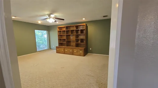 a view of an empty room with a bathroom