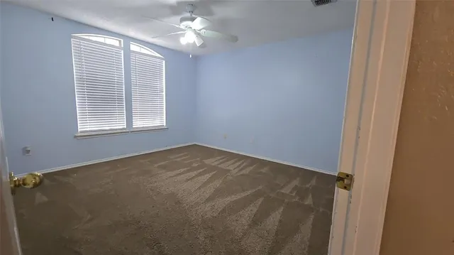 a view of empty room with windows