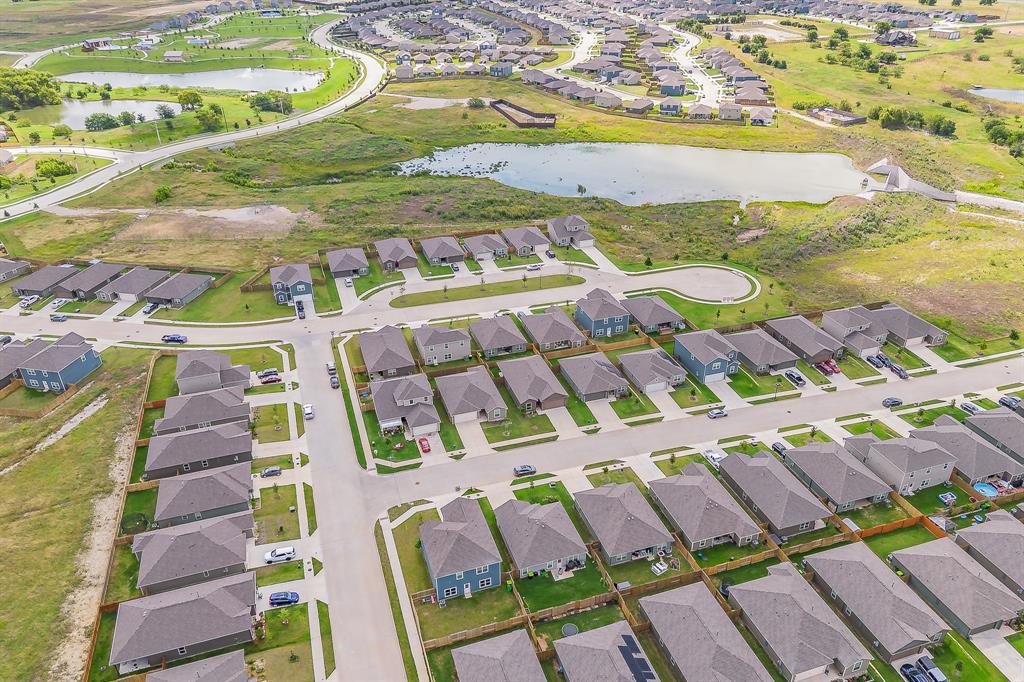 8125 White Sulphur Road Ponder, TX 76259 - Photo 35 of 38 Residential development featuring single-story and two-story homes with shingle roofs and private backyards