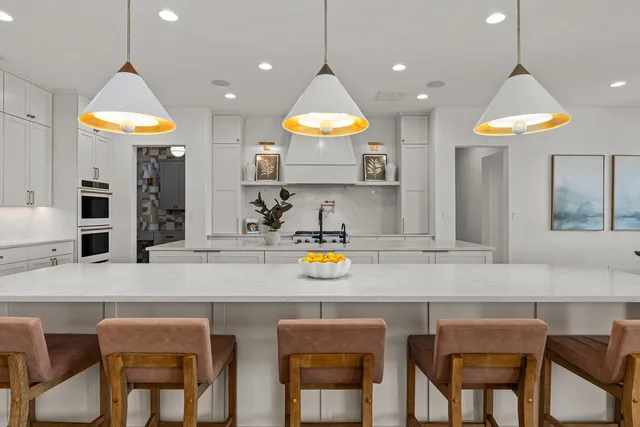 a kitchen with a table and chairs in it