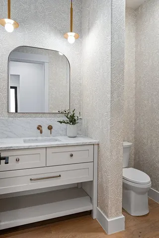 a kitchen with stainless steel appliances white cabinets and a window