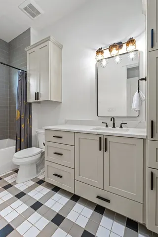 a living room with a bed furniture and a window