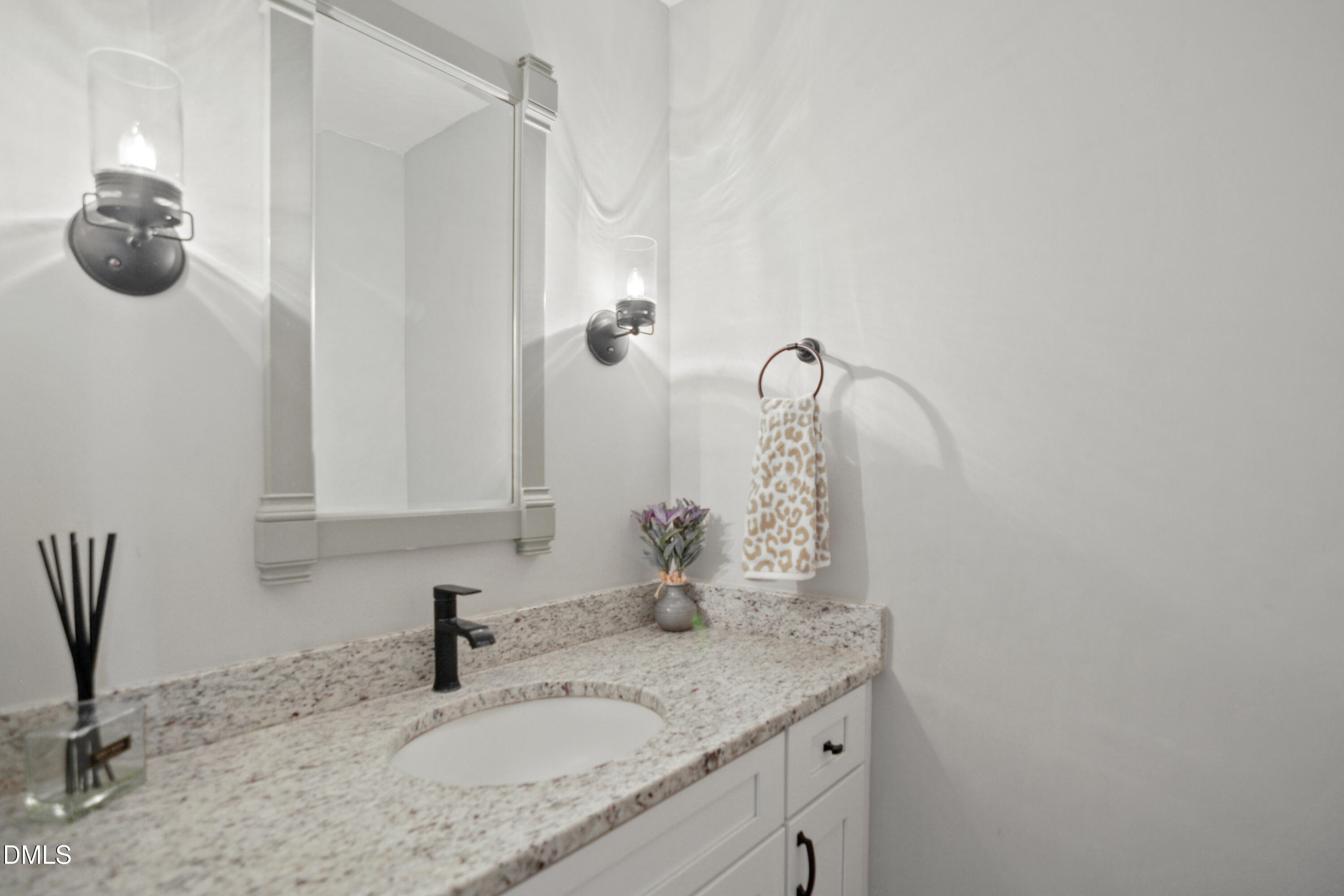 2704 Smokey Ridge Road Raleigh, NC 27613 - Photo 15 of 27 a bathroom with a granite countertop sink a mirror and shower