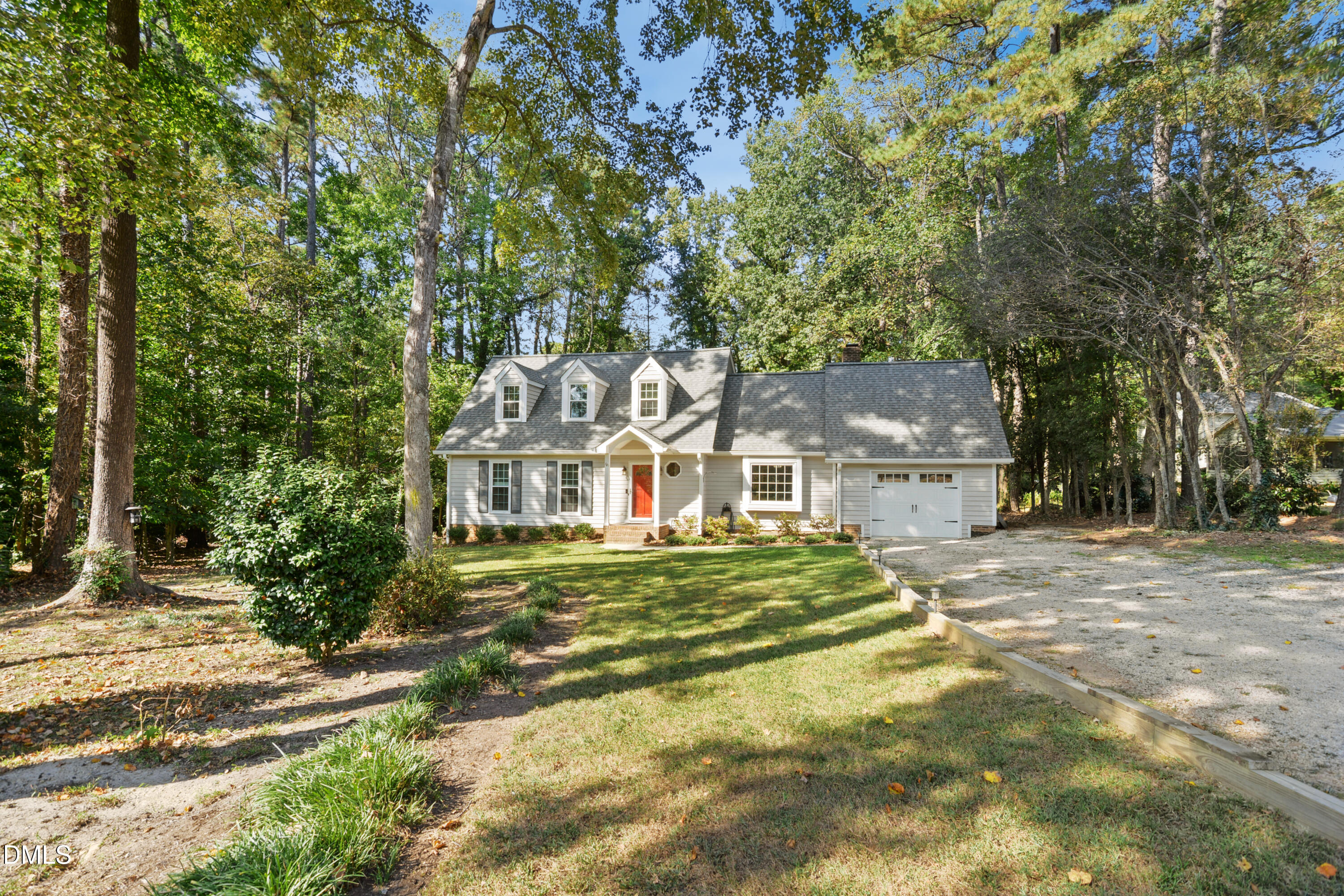 2704 Smokey Ridge Road Raleigh, NC 27613 - Photo 2 of 27 a front view of a house with a garden