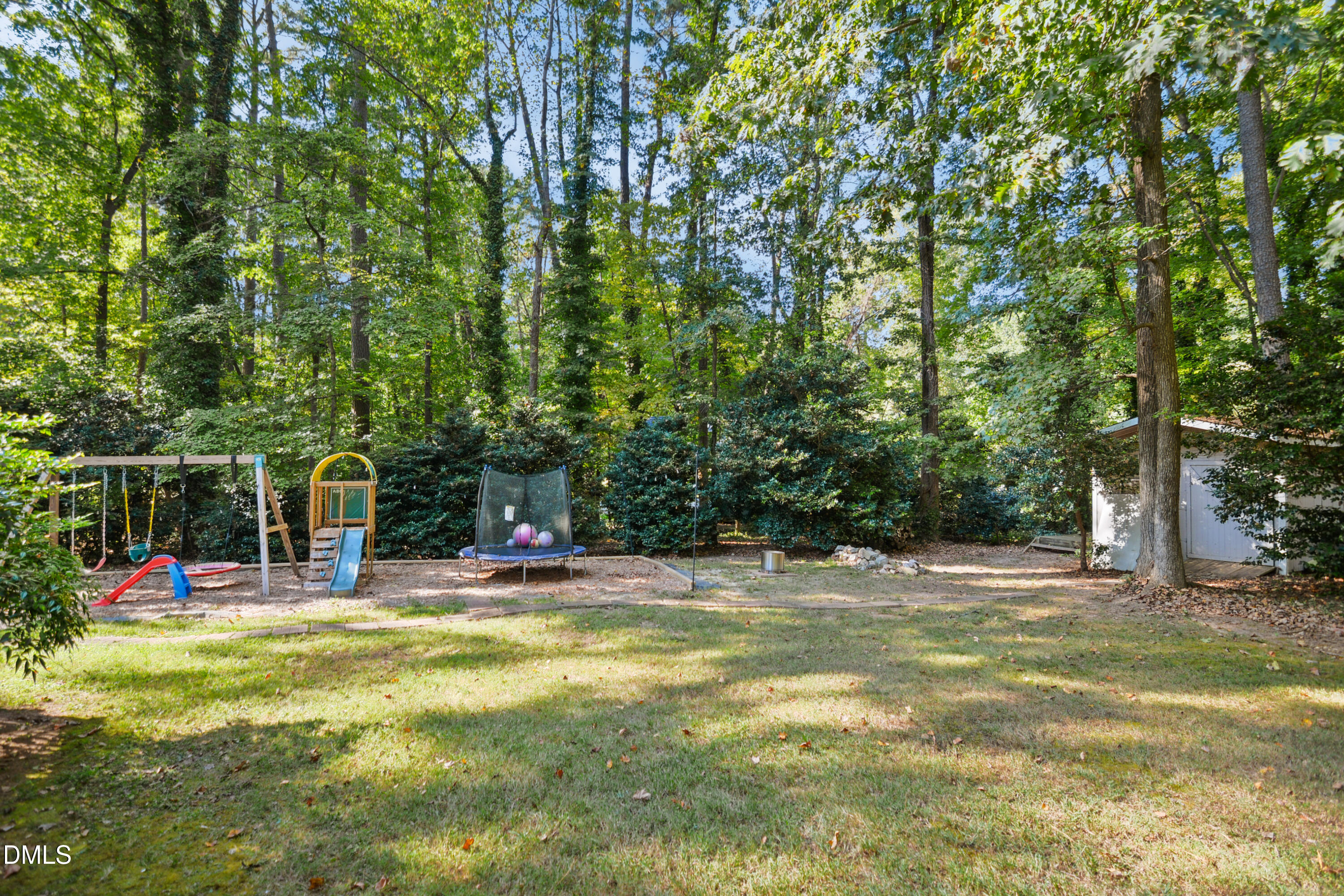 2704 Smokey Ridge Road Raleigh, NC 27613 - Photo 26 of 27 a view of outdoor space with garden and trees