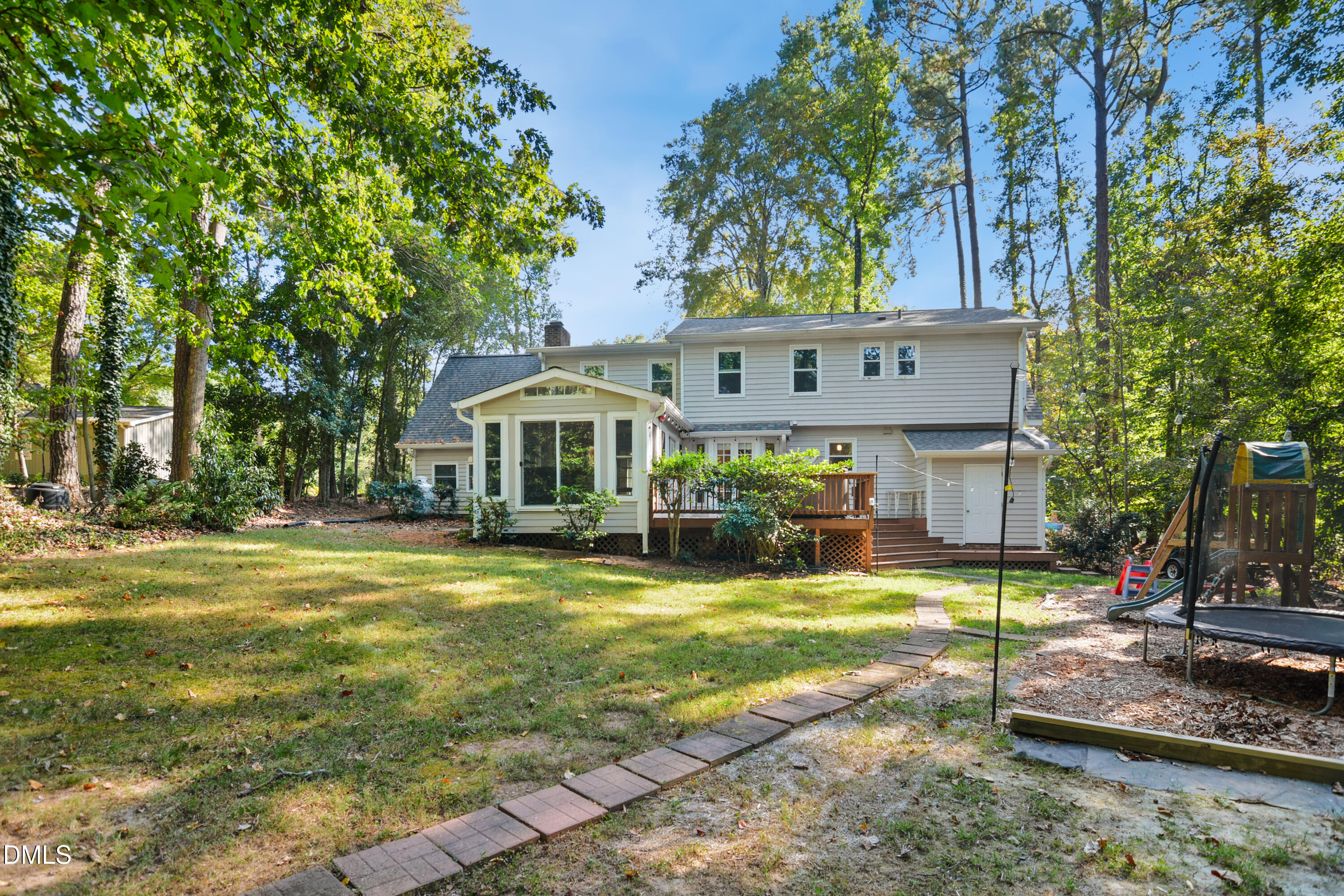 2704 Smokey Ridge Road Raleigh, NC 27613 - Photo 27 of 27 a view of a house with swimming pool and sitting area