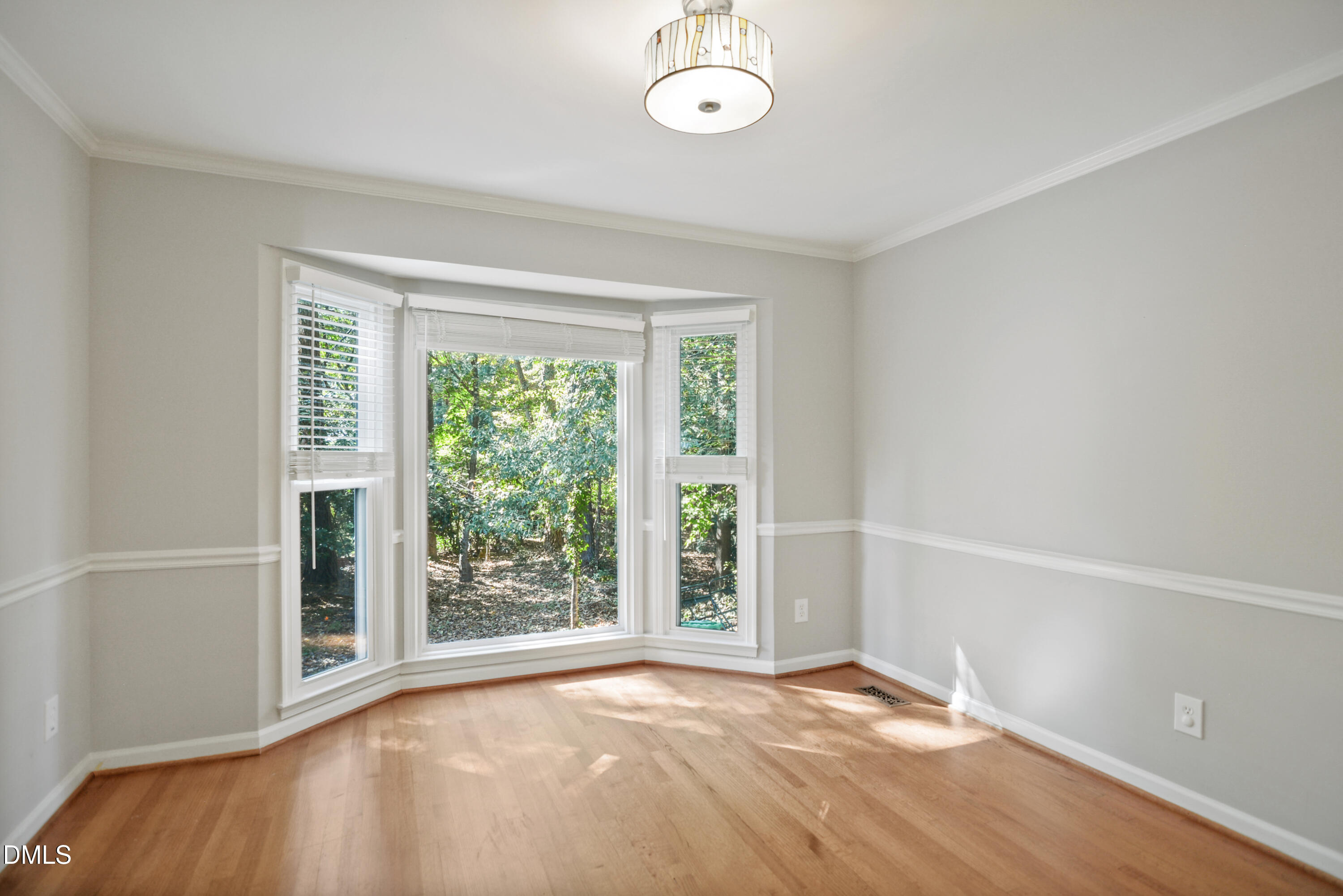 2704 Smokey Ridge Road Raleigh, NC 27613 - Photo 7 of 27 a view of an empty room with a window