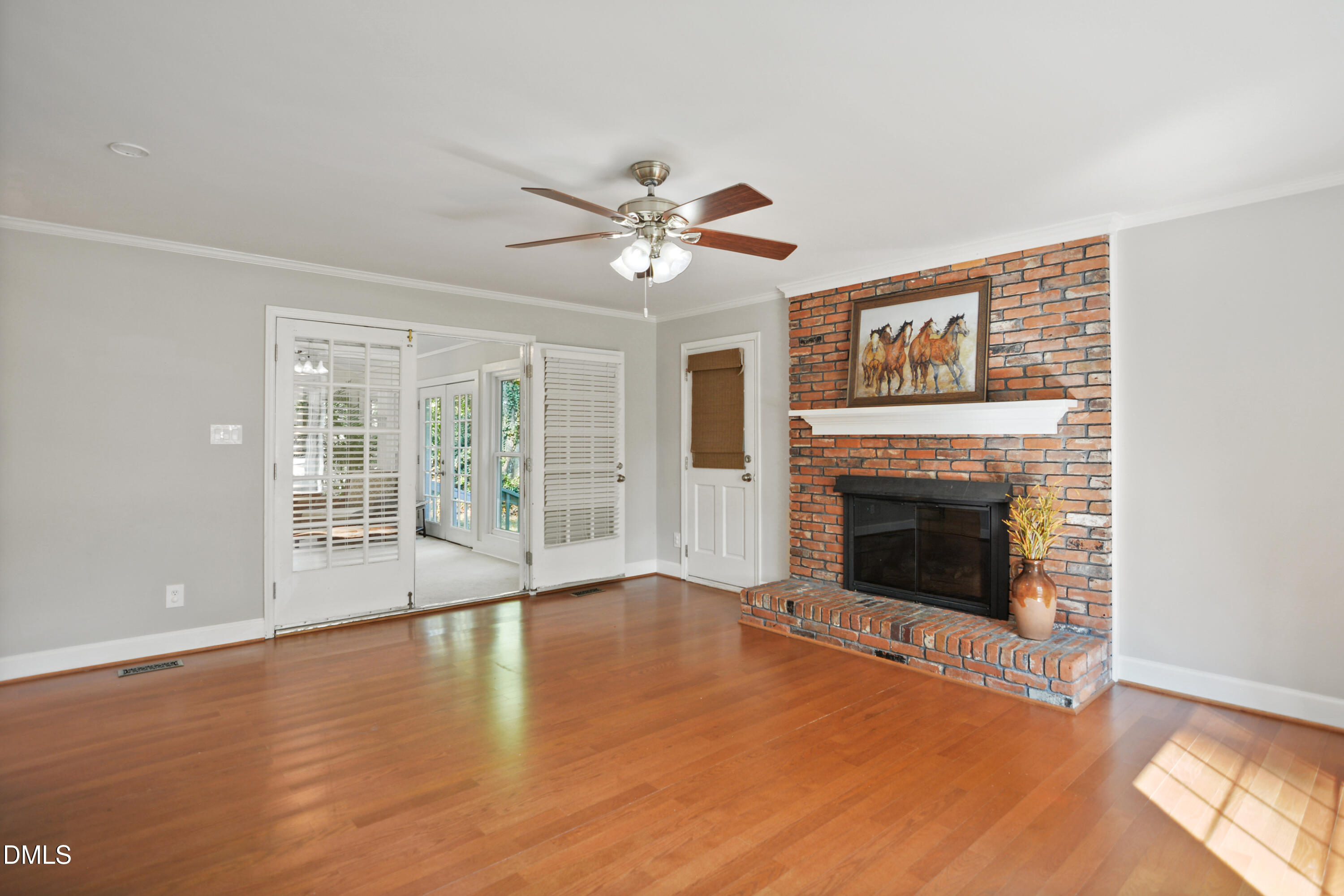 2704 Smokey Ridge Road Raleigh, NC 27613 - Photo 8 of 27 a view of an empty room with window and a fireplace