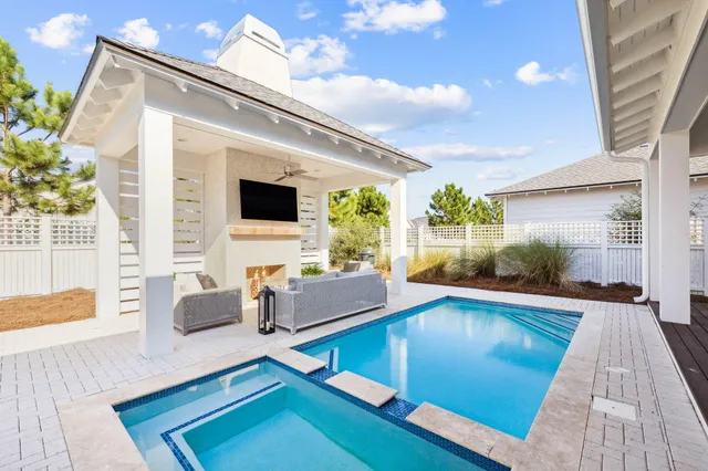 a view of a living room and kitchen with furniture