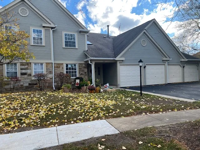 front view of a house with a small yard