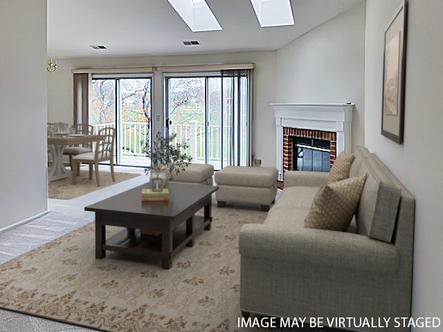 307 Glasgow Lane, Unit V2 Schaumburg, IL 60107 - Photo 4 of 15 a living room with furniture and a fireplace