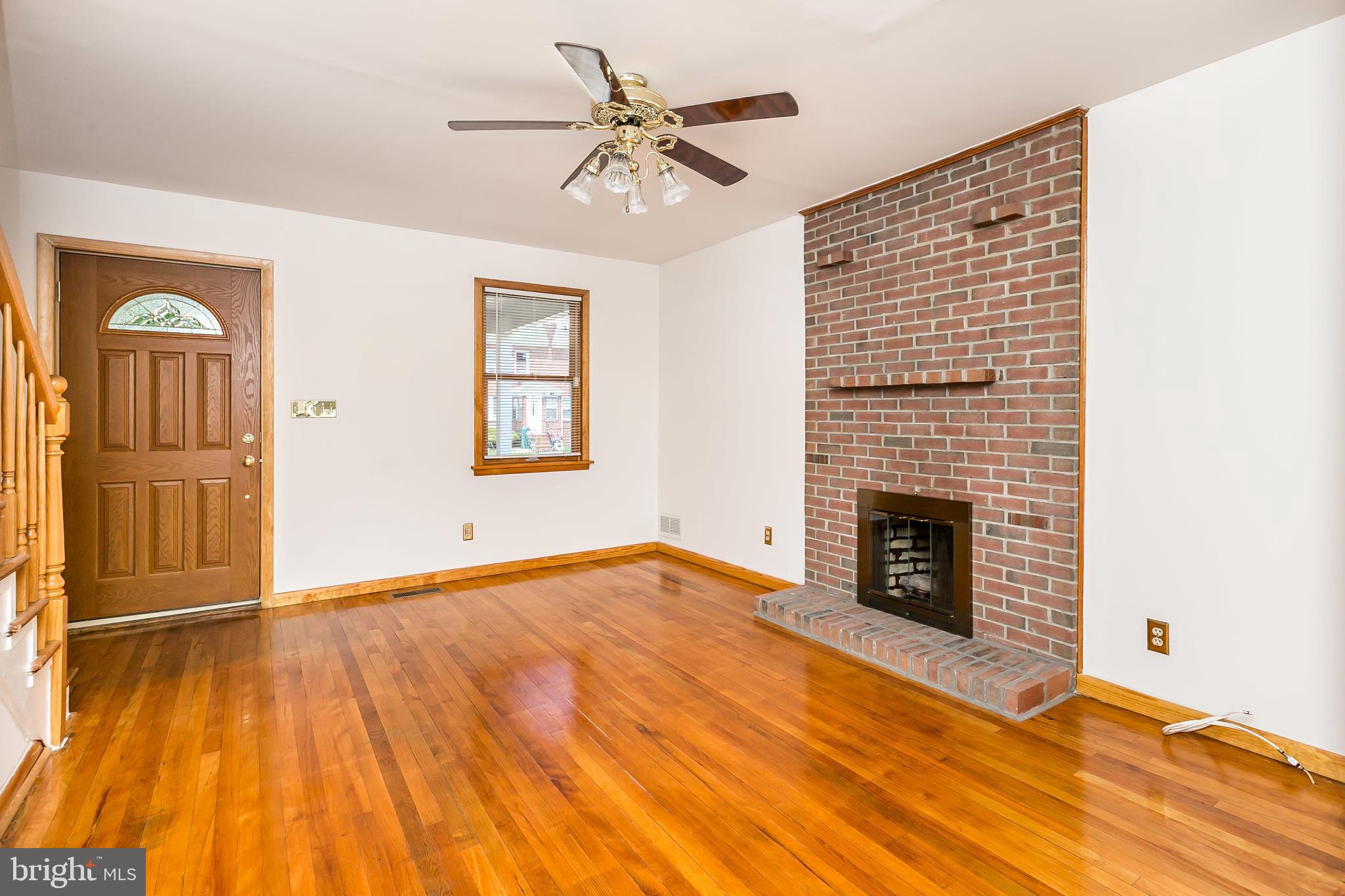 6841 Belclare Road Baltimore, MD 21222 - Photo 5 of 30 Living Room with wood burning Fireplace