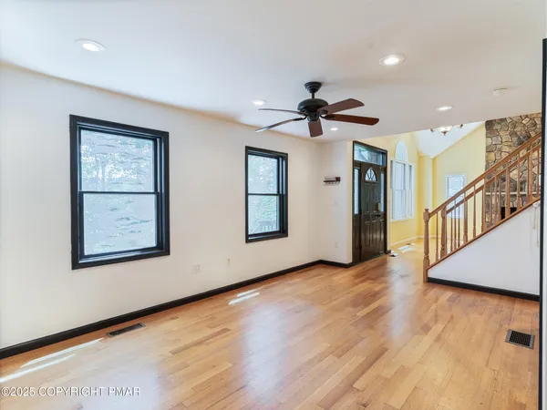 a kitchen with stainless steel appliances granite countertop a sink stove microwave and refrigerator