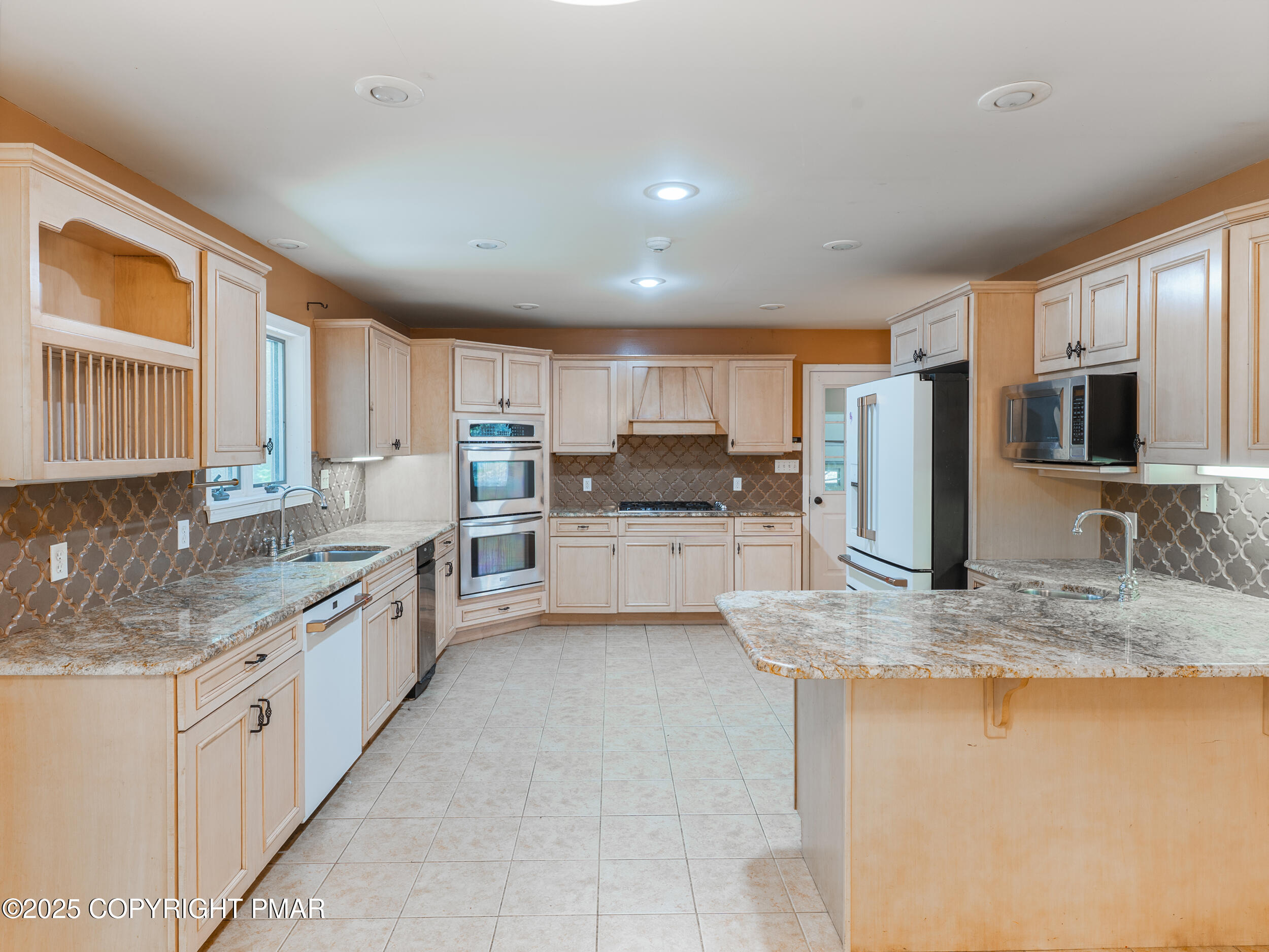 5110 Oak Lane Canadensis, PA 18325 - Photo 16 of 58 a kitchen with stainless steel appliances granite countertop a sink stove microwave and refrigerator