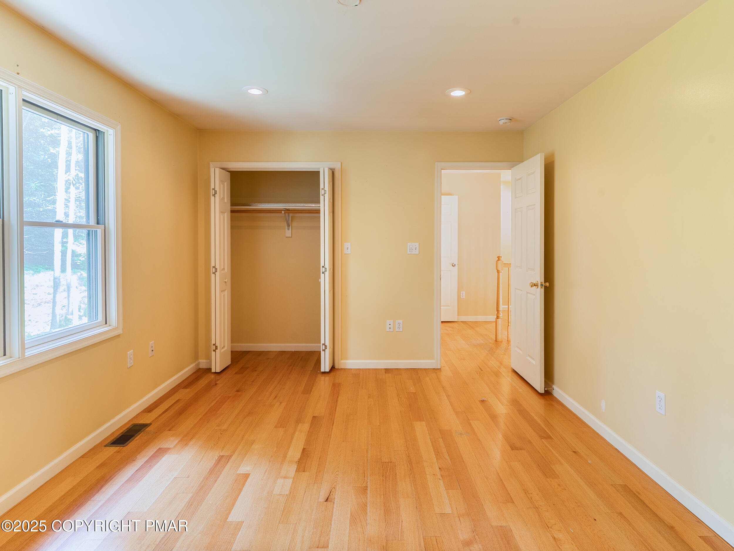 5110 Oak Lane Canadensis, PA 18325 - Photo 24 of 58 a view of empty room with wooden floor and fan