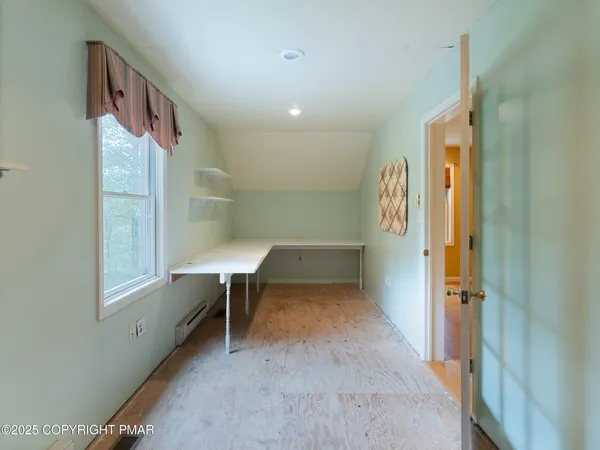 a view of hallway with livingroom and hallway