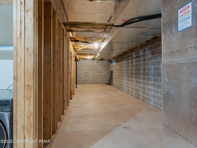 a view of a house with backyard and trees