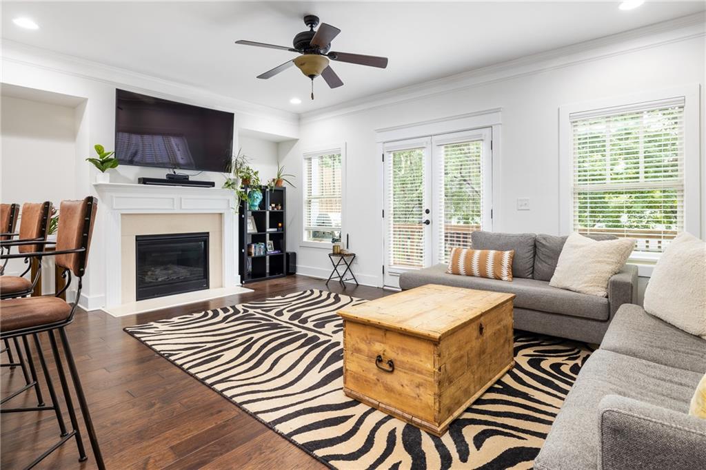 1347 Oakview Road Decatur, GA 30030 - Photo 1 of 1 a living room with fireplace furniture and a flat screen tv