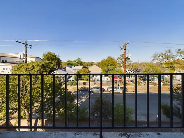 a view of a lake from a balcony