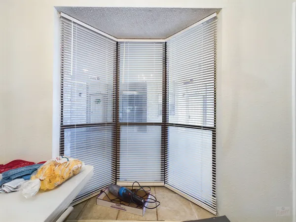 a view of a room with wooden floor and shoes