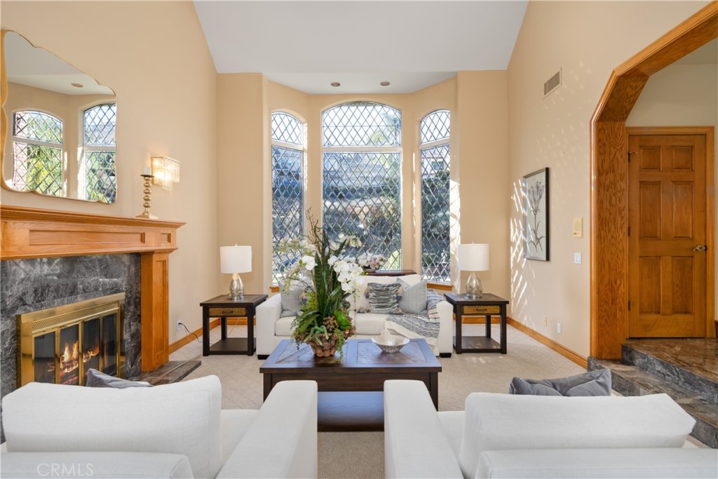 102 Mill Run Monrovia, CA 91016 - Photo 15 of 75 a living room with furniture fireplace and large windows