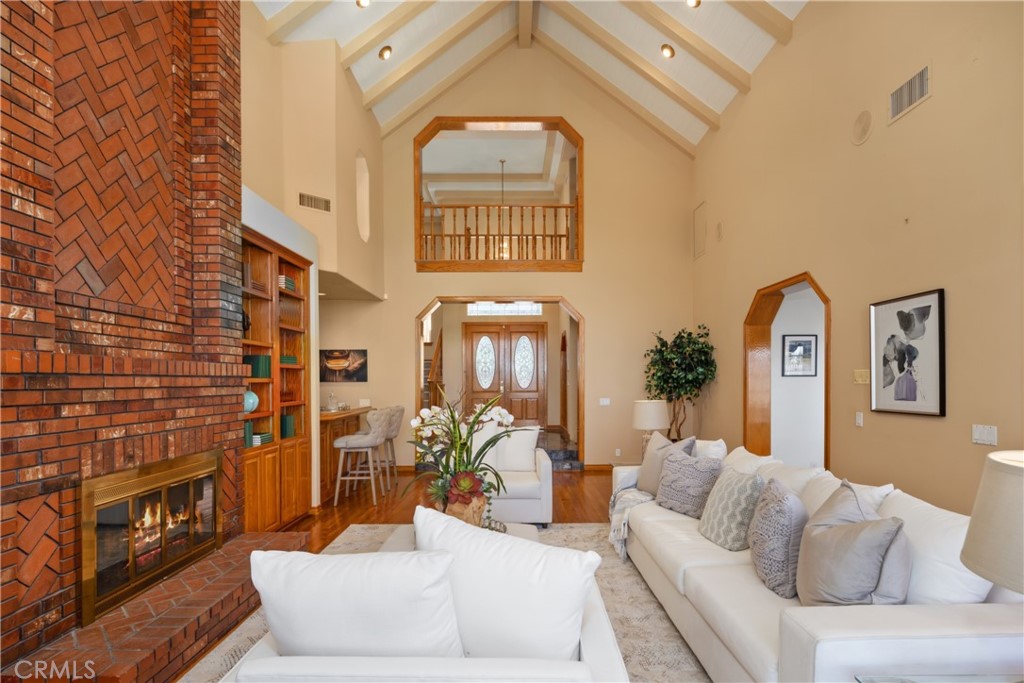 102 Mill Run Monrovia, CA 91016 - Photo 19 of 75 a living room with furniture a fireplace and a potted plant